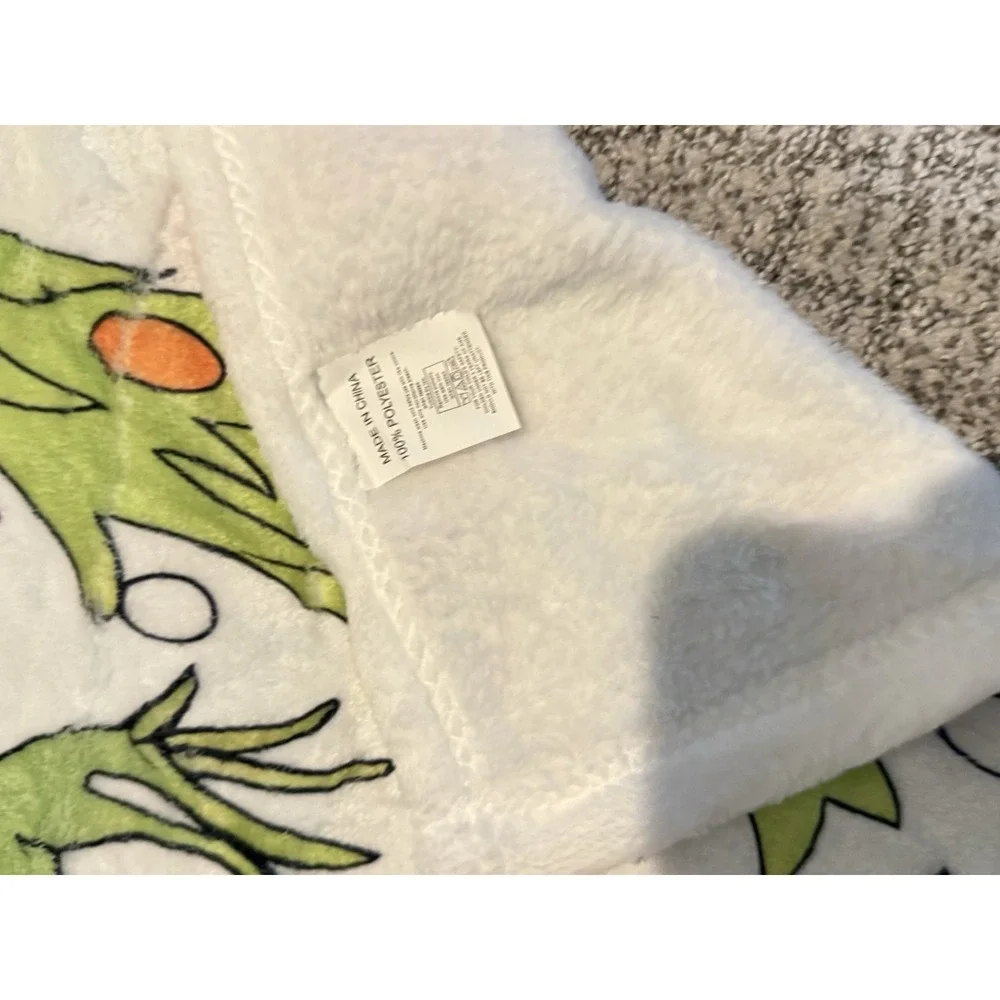 Dr. Seuss The Grinch throw blanket is made of super soft flannel fleece 40
